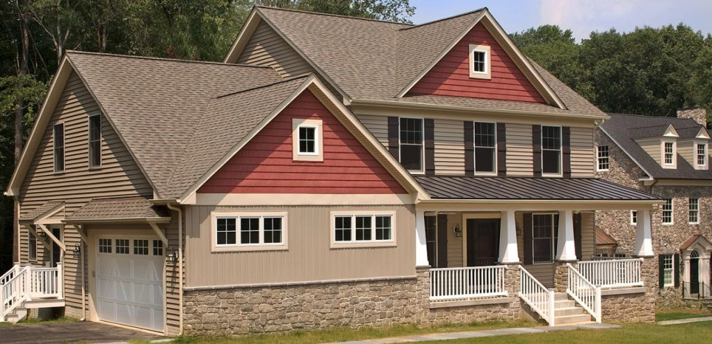 Charming two-story home featuring beige siding and red accents, ideal for remodeling projects in Baltimore County.