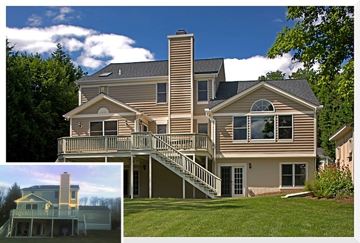 Modern two-story home with a wooden deck and large windows, showcasing professional construction in Catonsville.